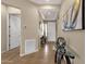 Welcoming entryway with neutral walls, tile flooring, an art piece, and a glass table at 4293 E Sourwood Dr, Gilbert, AZ 85298