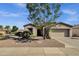 Single-story home with desert landscaping in front, featuring a low maintenance yard and a two car garage at 4293 E Sourwood Dr, Gilbert, AZ 85298