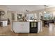 Kitchen island with breakfast bar, sink, and plenty of counter space, appliances, view to breakfast room at 4293 E Sourwood Dr, Gilbert, AZ 85298