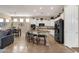 Modern kitchen with white cabinets, stainless steel appliances, and a breakfast bar with stools at 4293 E Sourwood Dr, Gilbert, AZ 85298