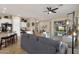 Spacious living room with a television, plenty of seating, an office, and an open layout at 4293 E Sourwood Dr, Gilbert, AZ 85298