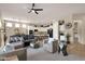 Open-concept living room with a comfortable seating arrangement, a kitchen, and a dining area at 4293 E Sourwood Dr, Gilbert, AZ 85298