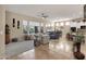 Spacious living area with an open floor plan, a kitchen, and large windows for plenty of light at 4293 E Sourwood Dr, Gilbert, AZ 85298