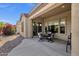 Covered patio with an outdoor dining set, offering a comfortable outdoor space at 4293 E Sourwood Dr, Gilbert, AZ 85298