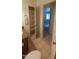 Tiled bathroom with ample storage and bright lighting at 475 S Seawynds Blvd, Gilbert, AZ 85233