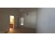 Spacious bedroom offering neutral carpet and bathroom access, with open view to the loft above at 475 S Seawynds Blvd, Gilbert, AZ 85233