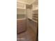 Organized walk-in closet with shelving and storage drawers at 475 S Seawynds Blvd, Gilbert, AZ 85233