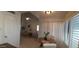 Cozy dining area with natural light from large shuttered window and an open view to the living room at 475 S Seawynds Blvd, Gilbert, AZ 85233