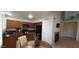 Charming kitchen with dark wood cabinets, stainless steel appliances, and a cozy breakfast nook with great light at 475 S Seawynds Blvd, Gilbert, AZ 85233