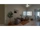 Comfortable living room with tile floors, neutral paint, shuttered windows, and stylish decorations at 475 S Seawynds Blvd, Gilbert, AZ 85233