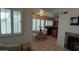 Inviting living space featuring tile floors, neutral paint, fireplace, and an open view to the kitchen at 475 S Seawynds Blvd, Gilbert, AZ 85233