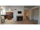 Large living area showcasing fireplace, tile floors, open staircase, and direct access to the kitchen at 475 S Seawynds Blvd, Gilbert, AZ 85233