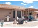 Spacious covered back porch featuring outdoor seating, a grill, and a serene desert view at 4970 S Desert Willow Dr, Gold Canyon, AZ 85118