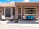 Inviting back porch setup with desert landscaping views, featuring comfortable seating and an open design at 4970 S Desert Willow Dr, Gold Canyon, AZ 85118
