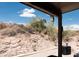 Scenic backyard view with rugged desert terrain, offering a natural and private setting at 4970 S Desert Willow Dr, Gold Canyon, AZ 85118