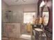 Modern bathroom with tiled walk-in shower, sleek fixtures, and granite countertops at 4970 S Desert Willow Dr, Gold Canyon, AZ 85118