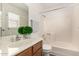 Bathroom with a single sink vanity, mirror, and a shower-tub combo at 520 N Stapley Dr # 253, Mesa, AZ 85203
