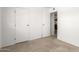 An empty bedroom with carpet and closet, offering plenty of storage space at 520 N Stapley Dr # 253, Mesa, AZ 85203