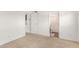 Vacant bedroom leading to a bathroom and kitchen through separate doorways at 520 N Stapley Dr # 253, Mesa, AZ 85203