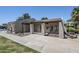 Welcoming community clubhouse featuring well-maintained building, picnic table, and shade from mature trees at 520 N Stapley Dr # 253, Mesa, AZ 85203
