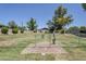 Fenced community dog park with a gate and a pet drinking station on a sunny day at 520 N Stapley Dr # 253, Mesa, AZ 85203