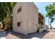 The rear exterior of this multifamily home is surrounded by lush foliage at 520 N Stapley Dr # 253, Mesa, AZ 85203