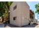 The rear exterior of this multifamily home is surrounded by lush foliage at 520 N Stapley Dr # 253, Mesa, AZ 85203