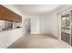 Open-concept living area with a breakfast bar and sliding doors to an outdoor patio at 520 N Stapley Dr # 253, Mesa, AZ 85203