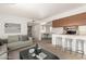 Bright living room features modern decor, open layout, and seamless integration with the kitchen and dining area at 520 N Stapley Dr # 253, Mesa, AZ 85203