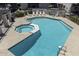 Community pool with a hot tub, lounge chairs, and a well-maintained deck for relaxation at 520 N Stapley Dr # 253, Mesa, AZ 85203