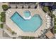 Aerial view of a community pool with lounge chairs and a spa at 520 N Stapley Dr # 253, Mesa, AZ 85203