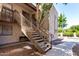 Apartment staircase with well maintained landscaping and neutral color scheme at 520 N Stapley Dr # 253, Mesa, AZ 85203