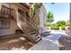 Apartment staircase with well maintained landscaping and neutral color scheme at 520 N Stapley Dr # 253, Mesa, AZ 85203