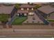 Aerial view of home showcasing the backyard patio, a putting green, and the surrounding neighborhood at 5239 W Leodra Ln, Laveen, AZ 85339