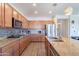 Spacious kitchen featuring stainless steel appliances, granite countertops, tile backsplash and center island at 5239 W Leodra Ln, Laveen, AZ 85339