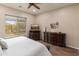 Cozy bedroom featuring neutral tones, natural light, and wood-look floors at 5649 E Desert Forest Trl, Cave Creek, AZ 85331