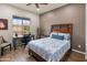 Comfortable bedroom features ample natural light and dedicated desk area at 5649 E Desert Forest Trl, Cave Creek, AZ 85331