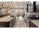 Open kitchen with granite counters, stainless appliances, and a seamless flow to living area at 5649 E Desert Forest Trl, Cave Creek, AZ 85331