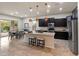Modern kitchen with granite countertops, stainless steel appliances, and a central island at 5649 E Desert Forest Trl, Cave Creek, AZ 85331