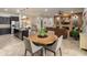 Open-concept space integrates the kitchen, dining area, and living room with cozy fireplace at 5649 E Desert Forest Trl, Cave Creek, AZ 85331