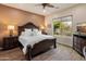 The main bedroom features a large bed, ensuite, and plenty of natural light at 5649 E Desert Forest Trl, Cave Creek, AZ 85331