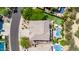 A birds-eye view shows the property's unique backyard features a pool, putting green, and ' play area at 6026 E Sonoran Trl, Scottsdale, AZ 85266