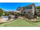 Extensive backyard offers a pool, putting green, lounge area, and fire pit for ultimate outdoor living and entertaining at 6026 E Sonoran Trl, Scottsdale, AZ 85266