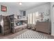 bedroom featuring a rustic wood bunk bed, soft rug, and ample natural light from shuttered windows at 6026 E Sonoran Trl, Scottsdale, AZ 85266