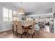 Dining room with seating for six features wicker chairs and stylish pendant lighting at 6026 E Sonoran Trl, Scottsdale, AZ 85266