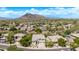 Inviting front facade with manicured landscape, neutral color palette, and mountain backdrop at 6026 E Sonoran Trl, Scottsdale, AZ 85266