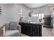 Cozy home office features elegant desk, comfortable seating, and ample lighting for a productive workspace at 6026 E Sonoran Trl, Scottsdale, AZ 85266