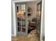 Inviting home office behind French doors features stylish decor, wood floors and neutral color palette at 6026 E Sonoran Trl, Scottsdale, AZ 85266