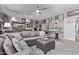 Large living room with a gray sectional sofa, shuffle board table, and a gallery wall at 6026 E Sonoran Trl, Scottsdale, AZ 85266