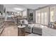 Inviting living room with tile flooring, cozy armchair, and easy access to the kitchen at 6026 E Sonoran Trl, Scottsdale, AZ 85266